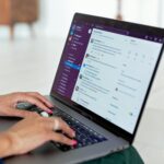 person typing on laptop computer